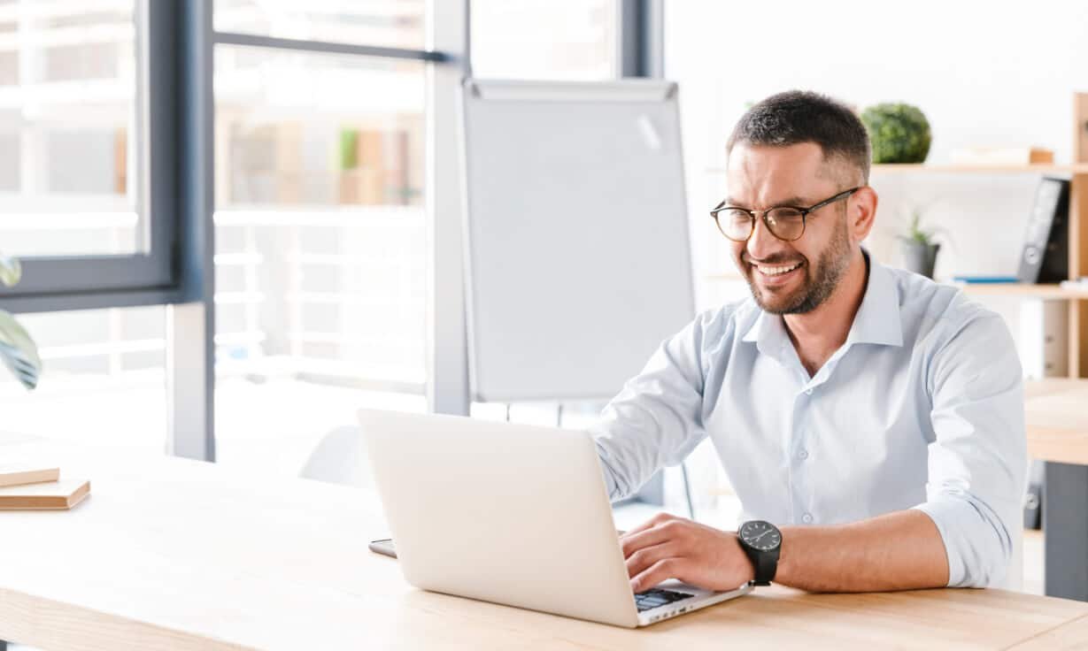 FinTech professional working on a laptop